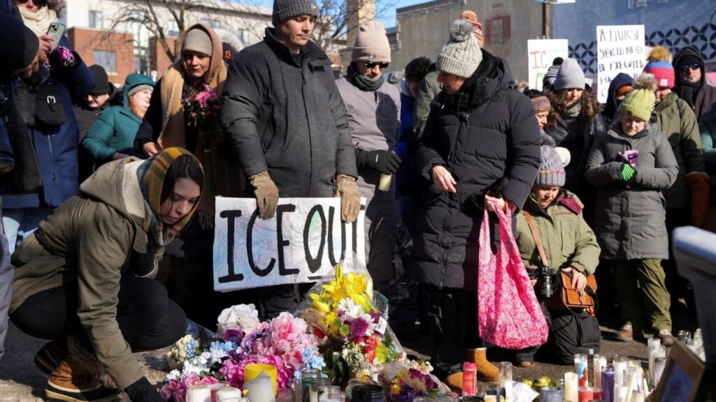 People gather at a makeshift memorial at the site where a man identified as Alex Pretti was fatally shot by federal immigration agents trying to detain him, in Minneapolis, Minnesota, U.S., January 25, 2026. (Reuters/Tim Evans)