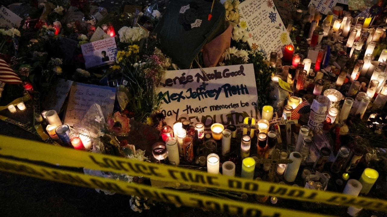 Police tape hangs in front of a makeshift memorial at the site where a man identified as Alex Pretti was fatally shot by federal immigration agents trying to detain him, in Minneapolis, Minnesota, U.S., January 26, 2026. (Reuters/Shannon Stapleton)