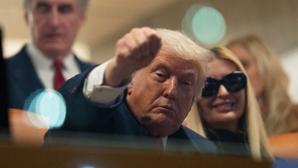 President Donald Trump gestures to fans while attending the College Football Championship at Hard Rock Stadium in Miami Gardens, Fla., on Monday, Jan. 19, 2026. (Allison Robbert/The New York Times)
