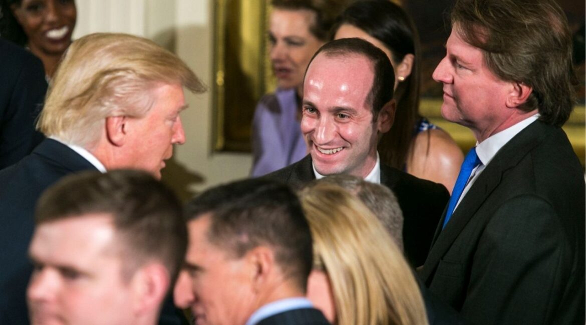 President Donald Trump, left, with adviser Stephen Miller, center, and Don McGahn, then White House counsel, during a swearing-in ceremony in the East Room of the White House in Washington, Jan. 22, 2017. Trump’s trusted adviser is casting his hard-right gaze abroad, saying the world must be governed by “force.” (Al Drago/The New York Times)