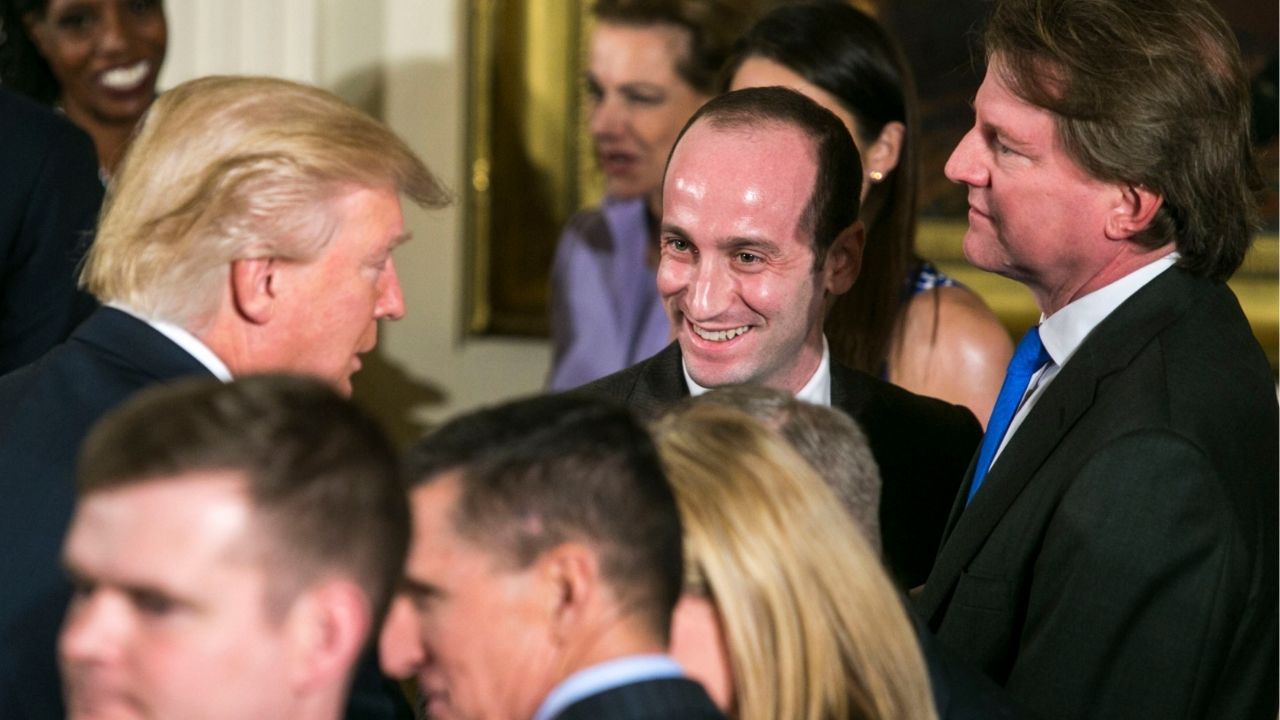 President Donald Trump, left, with adviser Stephen Miller, center, and Don McGahn, then White House counsel, during a swearing-in ceremony in the East Room of the White House in Washington, Jan. 22, 2017. Trump’s trusted adviser is casting his hard-right gaze abroad, saying the world must be governed by “force.” (Al Drago/The New York Times)