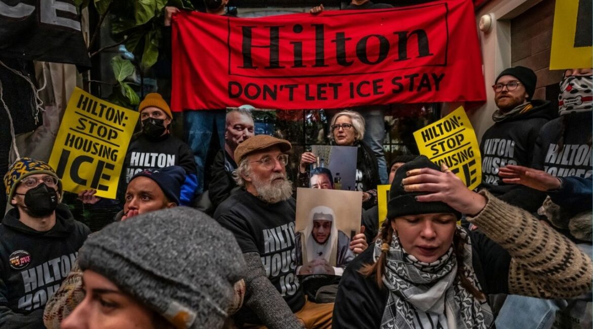 Protesters condemning Immigration and Customs Enforcement gather in the lobby of a Hilton Garden Inn in New York, on Tuesday, Jan. 27, 2026. The protesters directed their ire at Hilton for, they claimed, providing lodging to ICE agents. (Ashley Gilbertson/The New York Times)