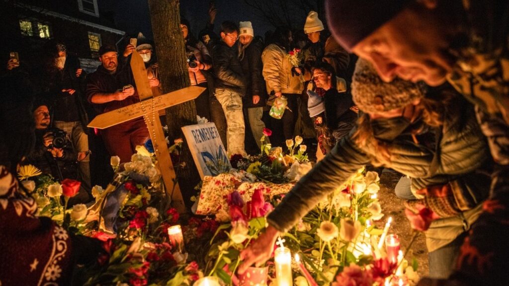 Protesters gather for a vigil near the site of a shooting where a federal officer shot and killed a 37-year-old woman in Minneapolis, Jan. 7, 2026. Federal investigators assigned to the fatal shooting of a 37-year-old Minneapolis woman are looking into her possible connections to activist groups protesting the Trump administration’s aggressive immigration enforcement, in addition to the actions of the federal agent who killed her, people familiar with the situation said. (David Guttenfelder/The New York Times)