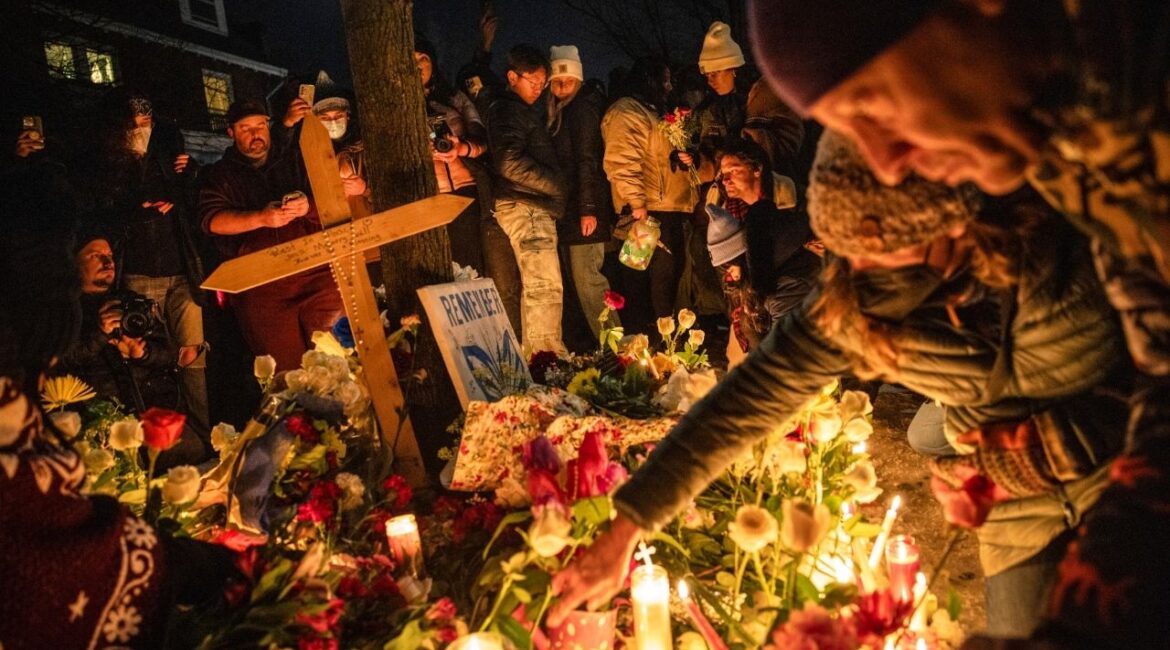 Protesters gather for a vigil near the site of a shooting where a federal officer shot and killed a 37-year-old woman in Minneapolis, Jan. 7, 2026. Federal investigators assigned to the fatal shooting of a 37-year-old Minneapolis woman are looking into her possible connections to activist groups protesting the Trump administration’s aggressive immigration enforcement, in addition to the actions of the federal agent who killed her, people familiar with the situation said. (David Guttenfelder/The New York Times)