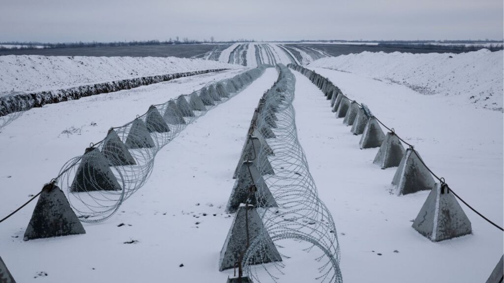 Razor wire and anti-tank “dragon’s teeth” on a Ukrainian line of defense in the Donbas region of Ukraine, Jan. 5, 2026. European leaders began meeting on Tuesday in Paris for the latest round of talks on peace for Ukraine, focusing on security commitments for the country in a potential cease-fire with Russia. (Tyler Hicks/The New York Times)