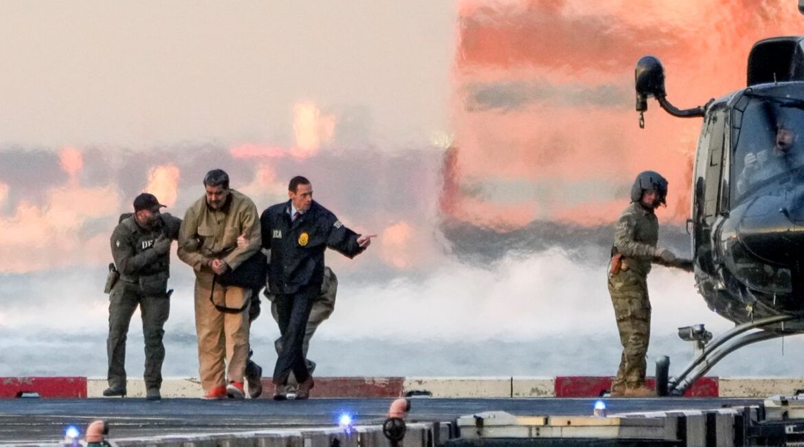 Image of a handcuffed Nicholas Madura and his wife being escorted away from a U.S. military helicopter in New York