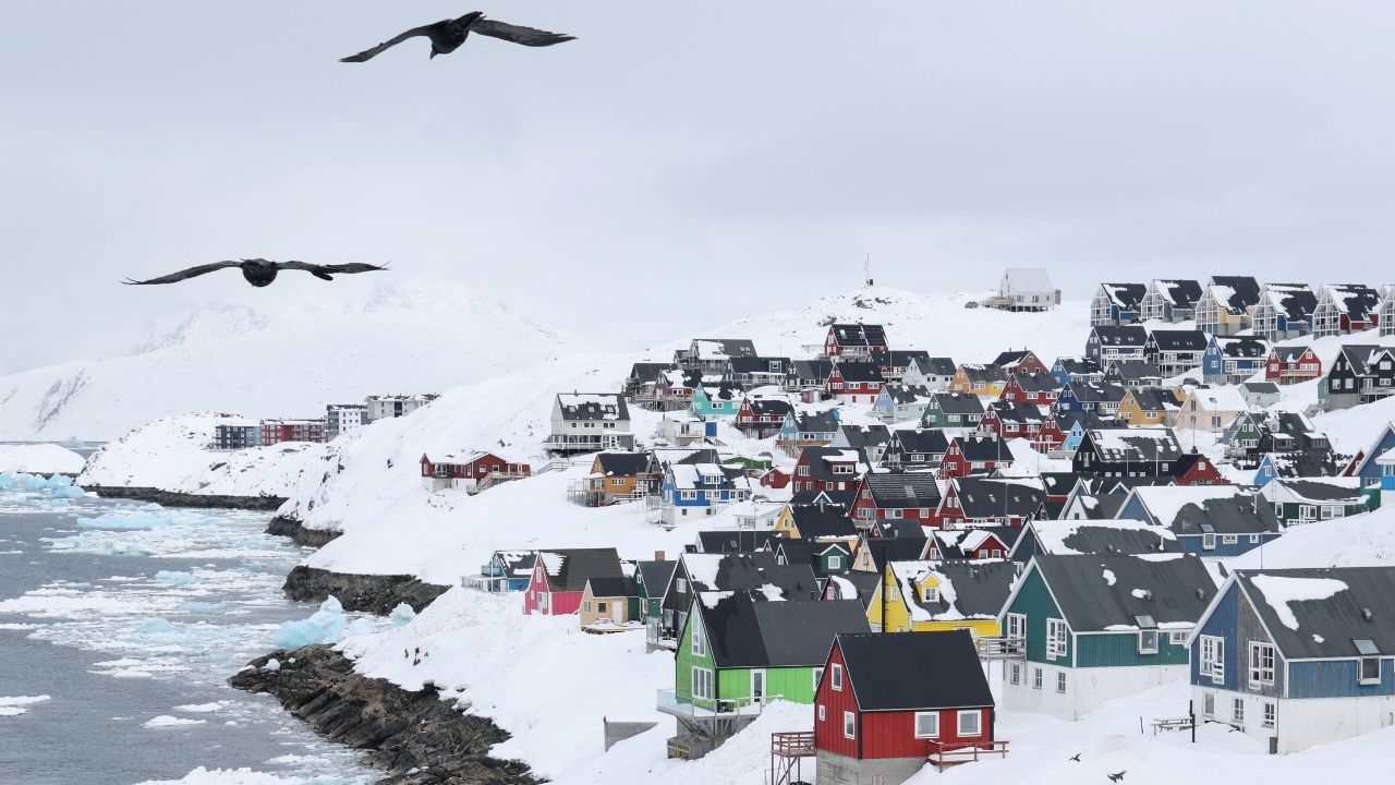 Seagulls fly over the old city of Nuuk, Greenland, March 29, 2025. (Reuters/Leonhard Foeger)
