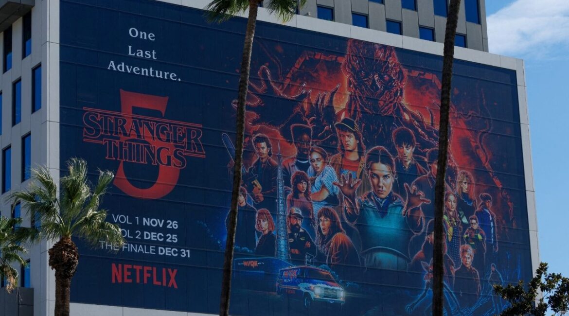 The Netflix logo and an advertisement for "Stranger Things" are shown on one of their buildings in the Hollywood neighborhood of Los Angeles, California, U.S., December 2, 2025. (Reuters/Mike Blake)