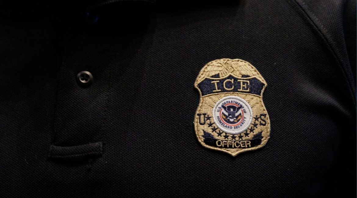 The badge of a U.S. Immigration and Customs Enforcement (ICE) is embroidered on a polo shirt of an ICE employee in Arlington, Texas, U.S. August 26, 2025. REUTERS/Shelby Tauber