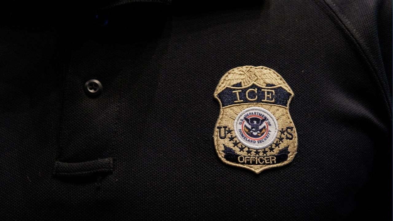The badge of a U.S. Immigration and Customs Enforcement (ICE) is embroidered on a polo shirt of an ICE employee in Arlington, Texas, U.S. August 26, 2025. REUTERS/Shelby Tauber