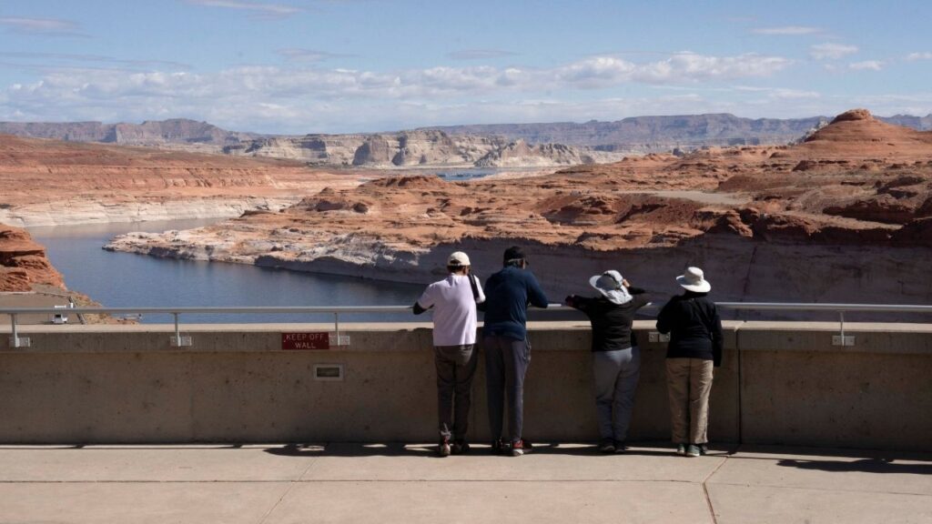 Tourists look at the Colorado River from Glen Canyon Dam near Page, Arizona, U.S., May 15, 2025. (Reuters/Rebecca Noble)