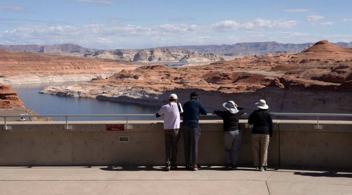 Tourists look at the Colorado River from Glen Canyon Dam near Page, Arizona, U.S., May 15, 2025. (Reuters/Rebecca Noble)