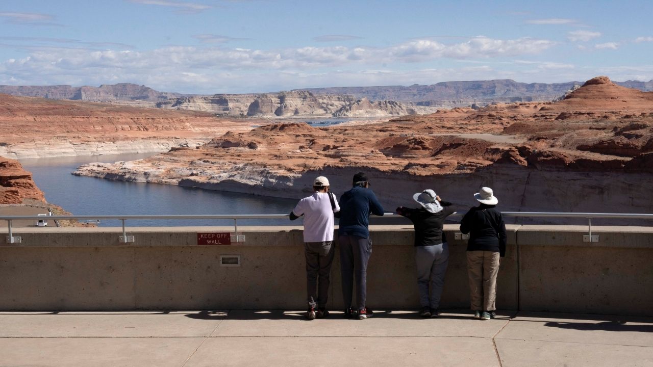 Tourists look at the Colorado River from Glen Canyon Dam near Page, Arizona, U.S., May 15, 2025. (Reuters/Rebecca Noble)
