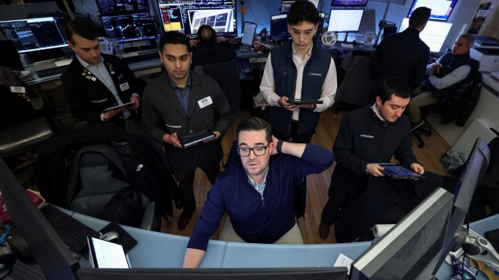 Traders work on the floor at the New York Stock Exchange (NYSE) in New York City, U.S., January 13, 2026. (Reuters/Brendan McDermid)