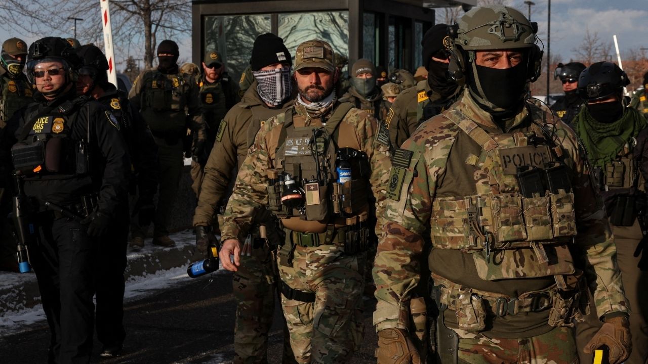 U.S. Immigration and Customs Enforcement (ICE) agents stand guard outside the Bishop Henry Whipple Federal Building during a demonstration against increased immigration enforcement, days after a U.S. Immigration and Customs Enforcement (ICE) agent fatally shot Renee Nicole Good, in Minneapolis, Minnesota, U.S., January 10, 2026. (Reuters/Tyrone Siu)