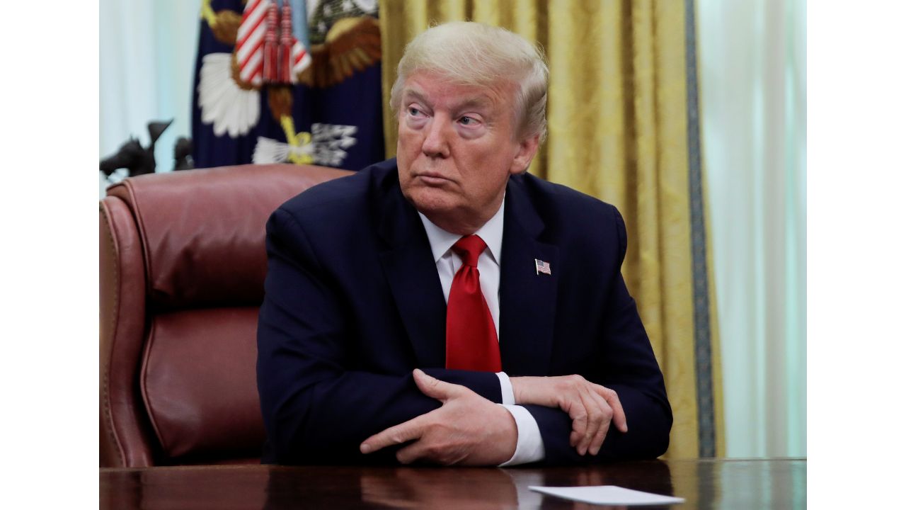 U.S. President Donald Trump listens during an event with Gilead Sciences on their work on HIV and Hepatitis C, in the Oval Office at the White House in Washington, U.S., May 1, 2020. (Reauters/Carlos Barria)
