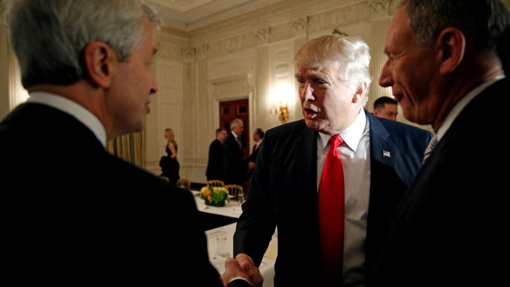 U.S. President Donald Trump shakes hands with JPMorgan Chase & Co CEO Jamie Dimon (L) as he hosts a strategy and policy forum with chief executives of major U.S. companies at the White House in Washington February 3, 2017. (Reuters/Kevin Lamarque/File Photo)
