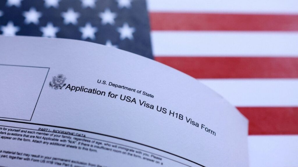 U.S. flag and U.S. H-1B Visa application form are seen in this illustration taken September 26, 2025. (Reuters File)