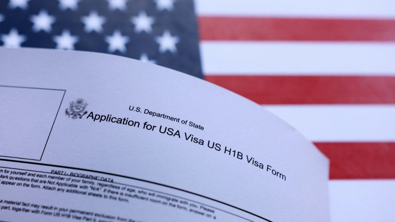 U.S. flag and U.S. H-1B Visa application form are seen in this illustration taken September 26, 2025. (Reuters File)