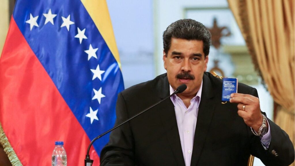 Venezuela's President Nicolas Maduro holds a copy of the Venezuelan constitution while he speaks during a meeting with members of the Venezuelan diplomatic corp after their arrival from the United States, at the Miraflores Palace in Caracas, Venezuela January 28, 2019. (Reuters File)