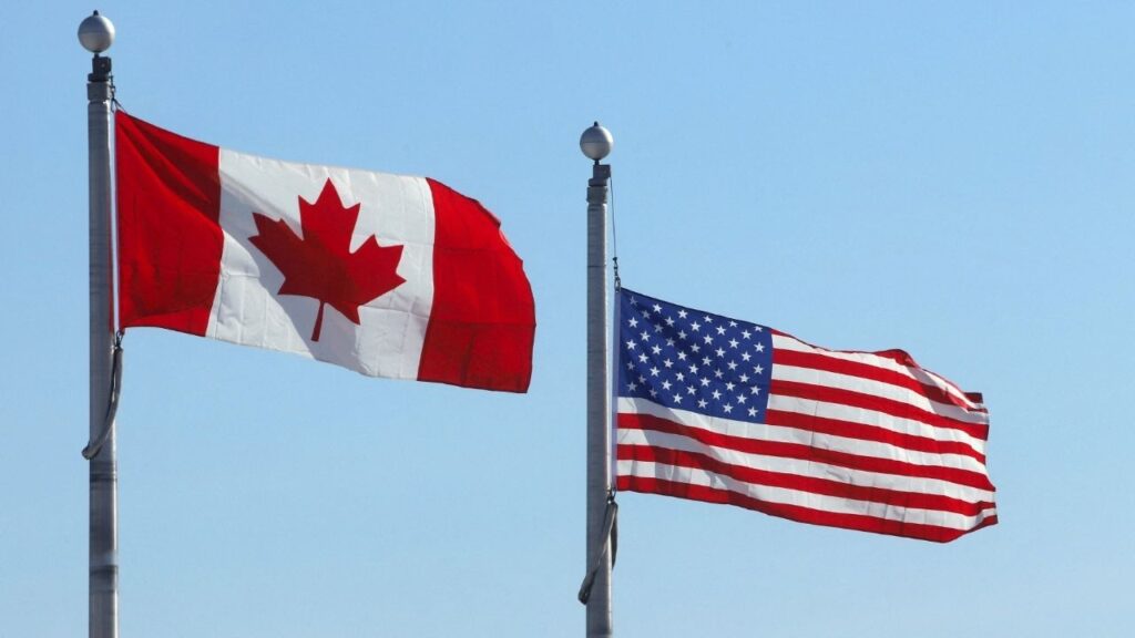 he Canadian and U.S. flags flutter at the Lansdowne Port of Entry next to the Thousand Islands Bridge in Lansdowne, Ontario, Canada February 12, 2025. (Reuters File)