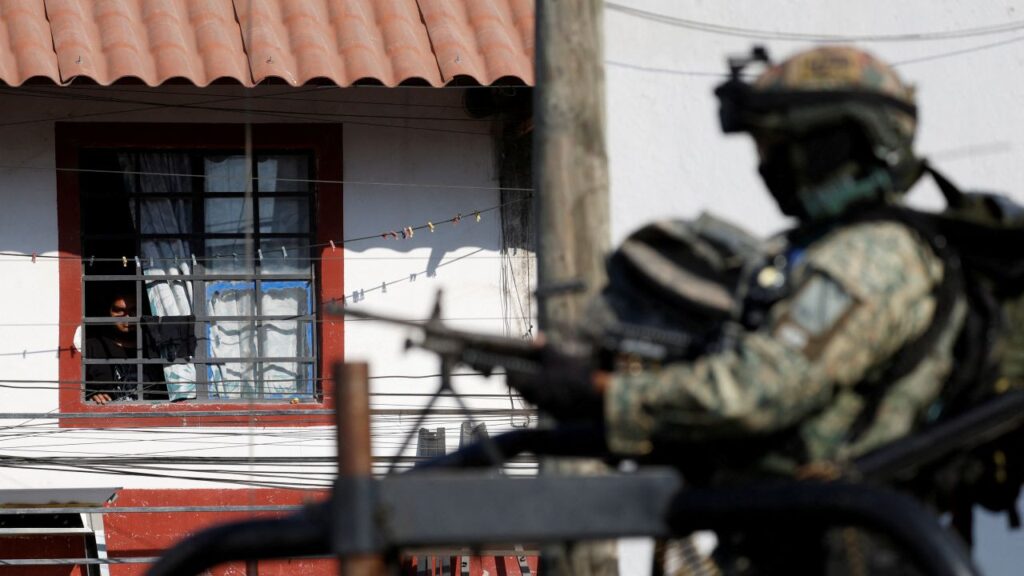 Image of Mexico's military patrolling a street in Puerto Vallarta.