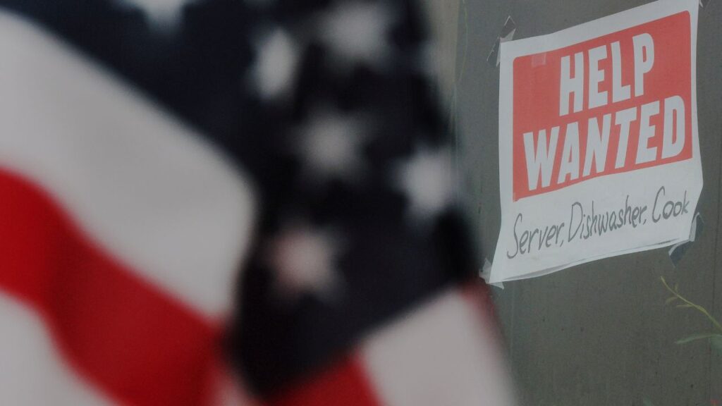 A “Help Wanted” sign hangs in restaurant window in Medford, Massachusetts, U.S., January 25, 2023. (Reuters/Brian Snyder)