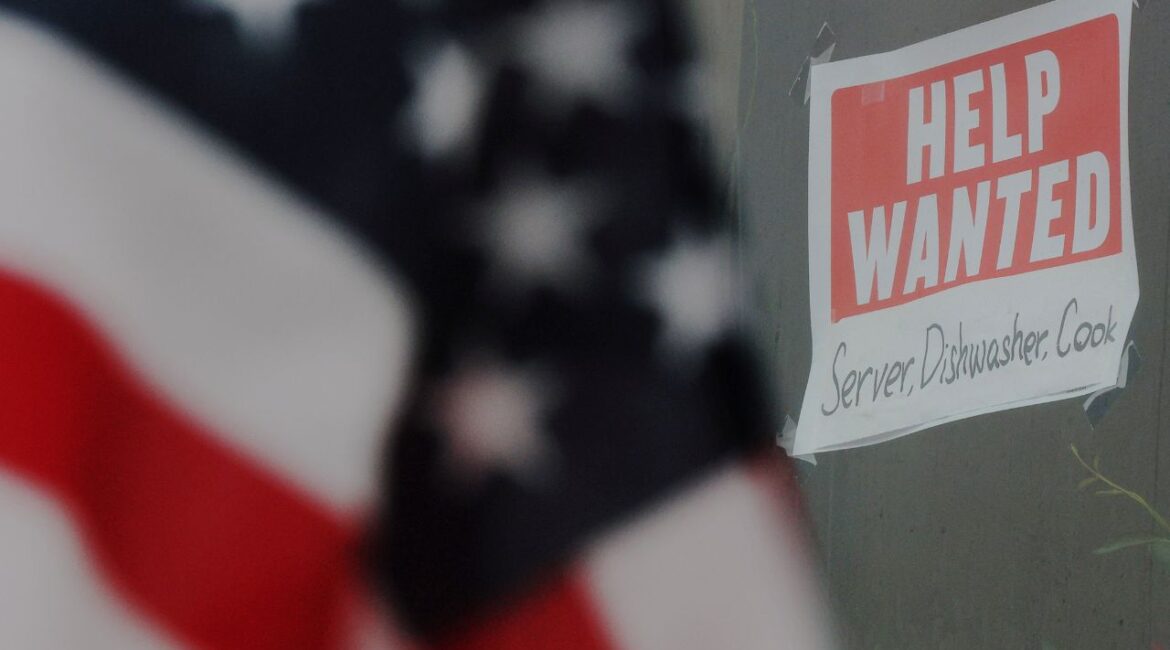 A “Help Wanted” sign hangs in restaurant window in Medford, Massachusetts, U.S., January 25, 2023. (Reuters/Brian Snyder)