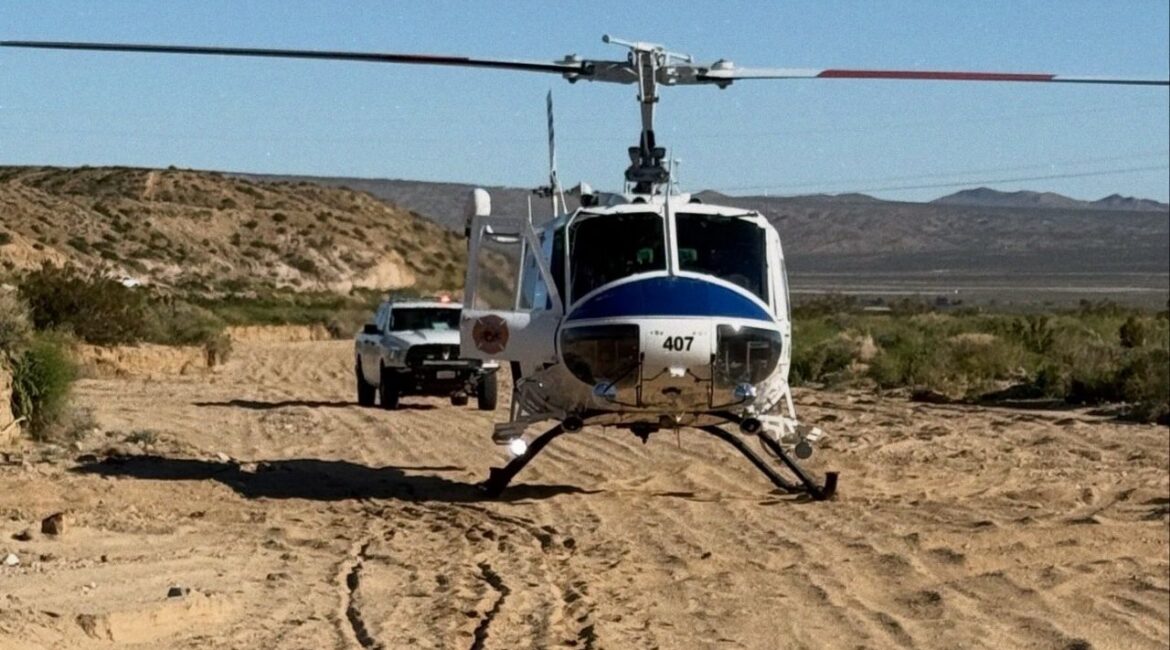 A Kern County Fire Department helicopter crew hoisted an injured patient from steep terrain in the Jaw Bone area Friday, Feb. 13, 2026, after family members hiked out to get cell service, transferring the person to an ambulance for further care. (Kern County FD)