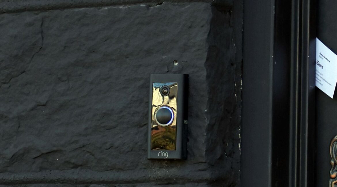 A Ring doorbell/security camera on the front of the house in Queens on Oct. 16, 2025. Ring created a Super Bowl commercial around the tale of a lost dog being reunited with his family through information harvested from a web of doorbell cameras. After much criticism that the commercial felt more invasive than heartwarming, Ring said it was ending a recent partnership with a surveillance technology firm. (Jefferson Siege/The New York Times)