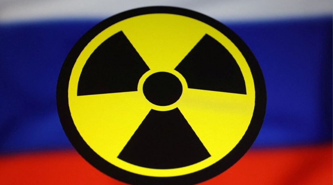 A Russian flag and a nuclear sign are seen in this illustration taken March 13, 2024. (Reuters/Dado Ruvic/Illustration)