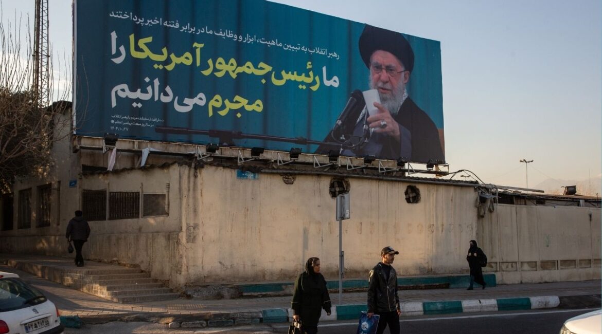 A billboard in Tehran, Iran, showing Iran’s supreme leader, Ayatollah Ali Khamenei, reads “We recognize the American president as a criminal,” Jan. 27, 2026. Senior U.S. and Iranian officials are expected to meet in Istanbul on Friday for talks aimed at de-escalating the crisis between their countries, according to two current regional officials and a former one who were familiar with the planning. (Arash Khamooshi/The New York Times)