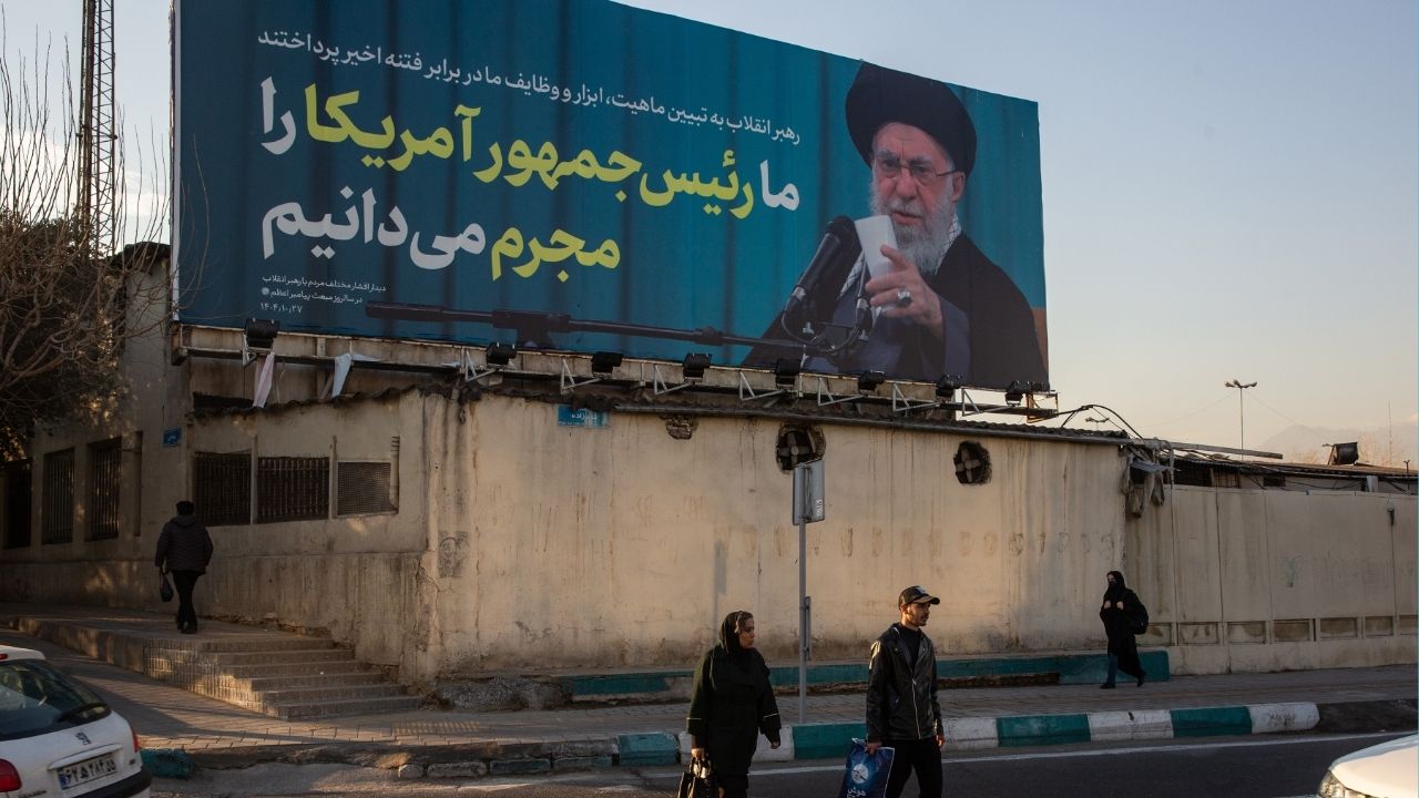 A billboard in Tehran, Iran, showing Iran’s supreme leader, Ayatollah Ali Khamenei, reads “We recognize the American president as a criminal,” Jan. 27, 2026. Senior U.S. and Iranian officials are expected to meet in Istanbul on Friday for talks aimed at de-escalating the crisis between their countries, according to two current regional officials and a former one who were familiar with the planning. (Arash Khamooshi/The New York Times)
