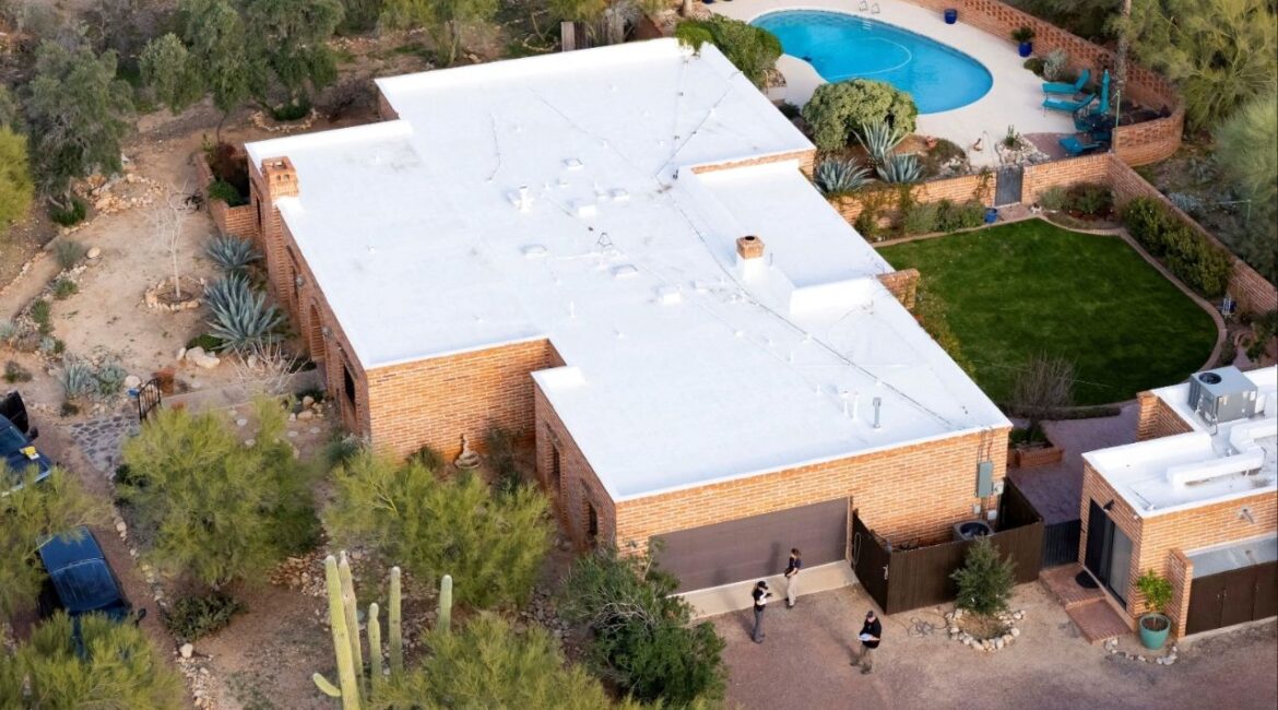 A drone view shows investigators searching the home of Nancy Guthrie, the 84-year-old mother of U.S. journalist and television host Savannah Guthrie, who went missing from her home in Tucson, Arizona, U.S., February 6, 2026. REUTERS/Rebecca Noble