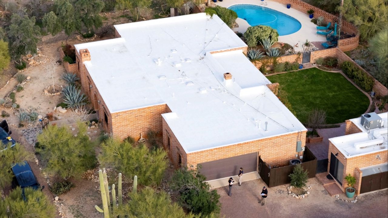 A drone view shows investigators searching the home of Nancy Guthrie, the 84-year-old mother of U.S. journalist and television host Savannah Guthrie, who went missing from her home in Tucson, Arizona, U.S., February 6, 2026. REUTERS/Rebecca Noble
