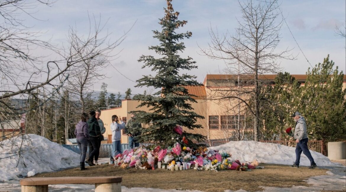 A makeshift memorial for the victims of a mass shooting at Tumbler Ridge Secondary School in Tumbler Ridge, British Columbia, Feb. 12, 2026. Canadian officials have summoned leaders from OpenAI for a meeting following revelations that the company did not inform the authorities about a user whose account had been suspended months before she committed a mass murder in British Columbia. (Alana Paterson/The New York Times)