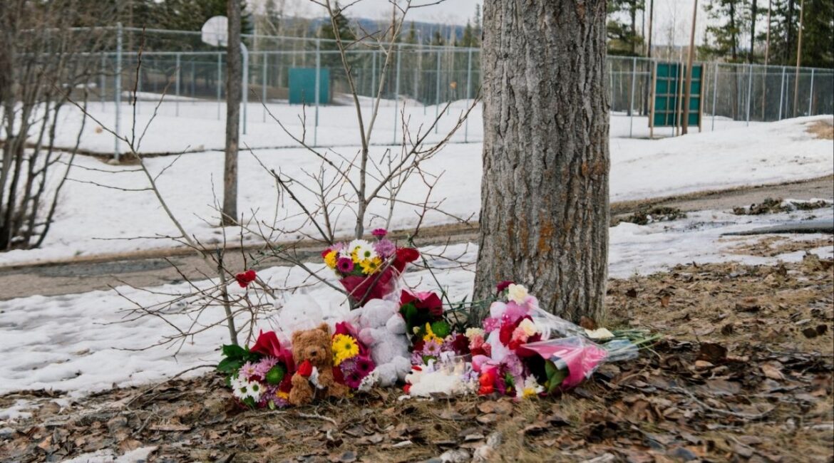 A makeshift memorial near a middle and high school building where a shooting took place on Tuesday in Tumbler Ridge, British Columbia, Canada, on Wednesday, Feb. 11, 2026. The Canadian authorities on Wednesday identified the suspect in the mass shooting as an 18-year-old who killed her mother and stepbrother before fatally shooting several others at the school. (Alana Paterson/The New York Times)
