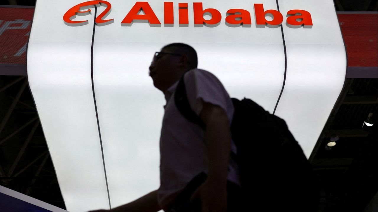 A man walks past the Alibaba logo displayed at its booth during the China International Supply Chain Expo in Beijing, China July 16, 2025. (Reuters File)
