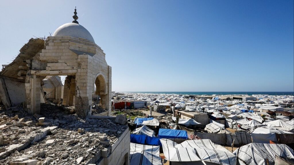 A mosque, destroyed during the two-year Israeli offensives, is surrounded by tents for displaced Palestinians, in Gaza City, February 11, 2026. (Reuters/Mahmoud Issa)