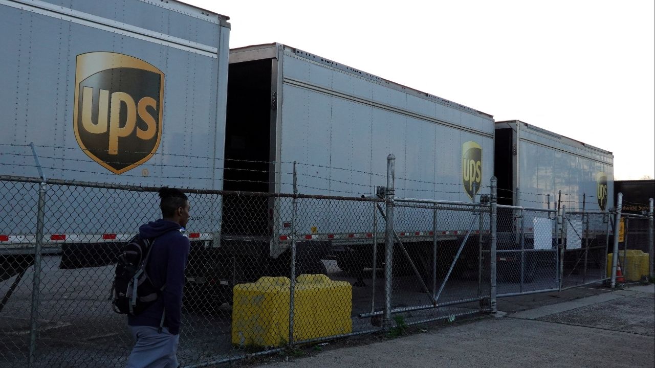 A person walks by United Parcel Service (UPS) trailers at a facility in Brooklyn, New York City, U.S., May 9, 2022. (Reuters File)
