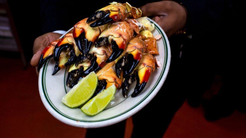 A plate of stone crabs at Joe’s Stone Crab restaurant in Miami Beach, Fla., Dec. 7, 2018. Jo Ann Bass, the matriarch of Joe’s Stone Crab, a century-old family restaurant that leveraged the claws of a ubiquitous local crustacean in becoming a Miami Beach institution, not unlike the Fontainebleau hotel and the Art Deco jewels of Ocean Drive, died on Jan. 31, 2026, at her home in that city. She was 94. (Saul Martinez/The New York Times).
