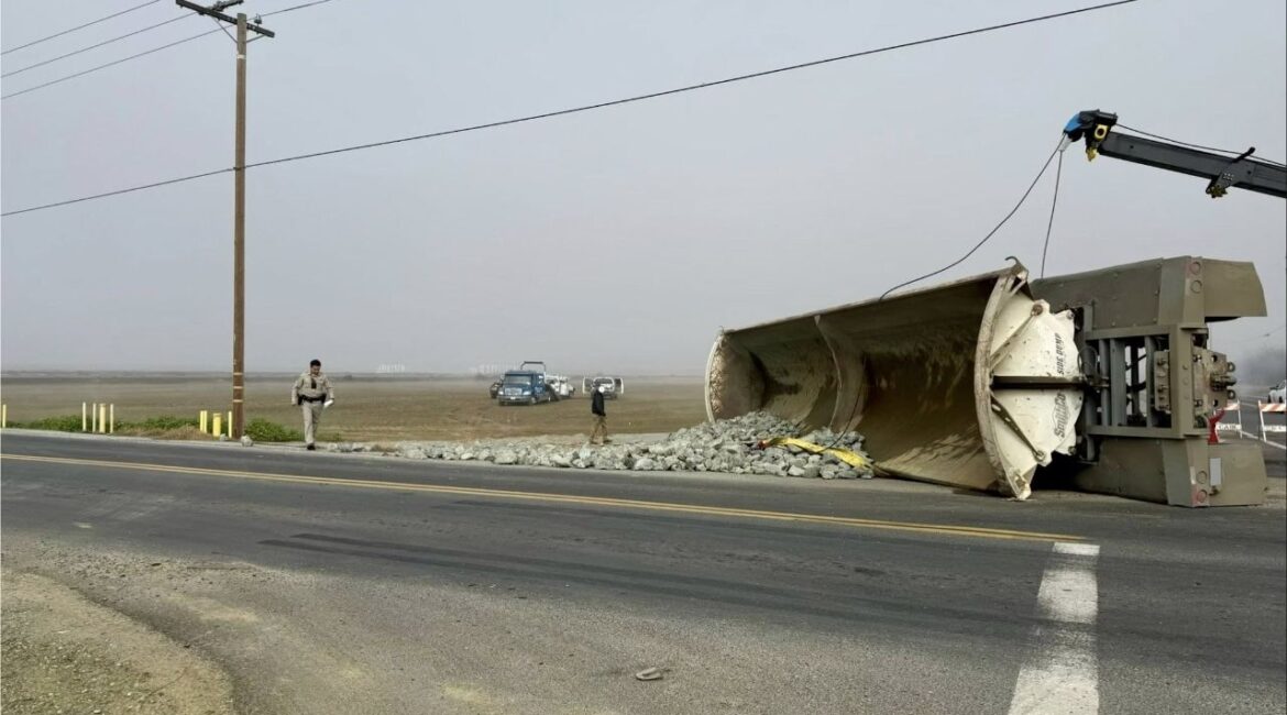 A side-dump trailer overturned in a two-vehicle crash involving a Chevrolet 2500 and a Peterbilt 386 at the intersection of Road 208 and Avenue 128 on Thursday, Feb. 5, 2026. (CHP)