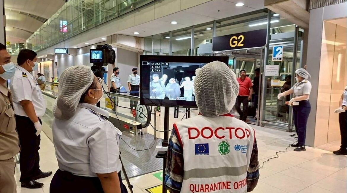 Airport health authorities wearing protective masks monitor passengers from international flights arriving at Suvarnabhumi International Airport in Bangkok, Thailand, January 25, 2026, following the implementation of health screening measures for passengers arriving from West Bengal, India, amid reports of a Nipah virus outbreak. (Suvarnabhumi Airport Office/Handout via Reuters)
