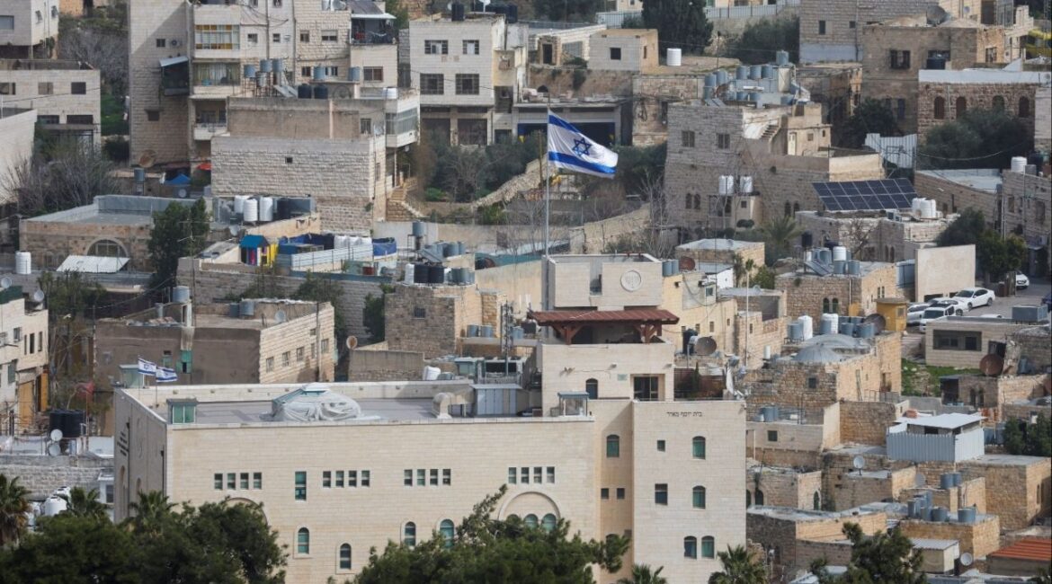 An Israeli flag flies over an Israeli settlement in the old city in Hebron in the Israeli-occupied West Bank, February 9, 2026. (Reuters/Mussa Qawasma)