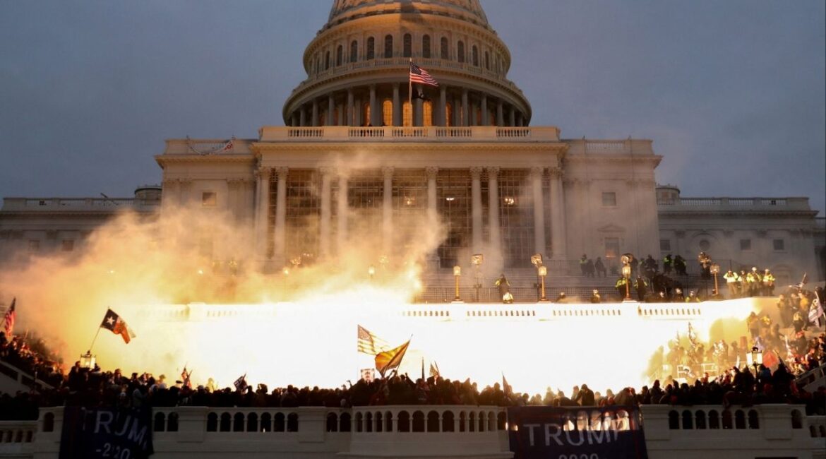 An explosion caused by a police munition is seen while supporters of U.S. President Donald Trump riot in front of the U.S. Capitol Building in Washington, U.S., January 6, 2021. (Reuters/Leah Millis)