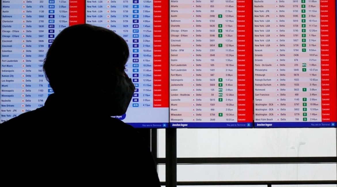 Cancelled flights are displayed on a board at Logan International Airport during a winter blizzard snow storm in Boston, Massachusetts, U.S., February 23, 2026. (Reuters/Brian Snyder)