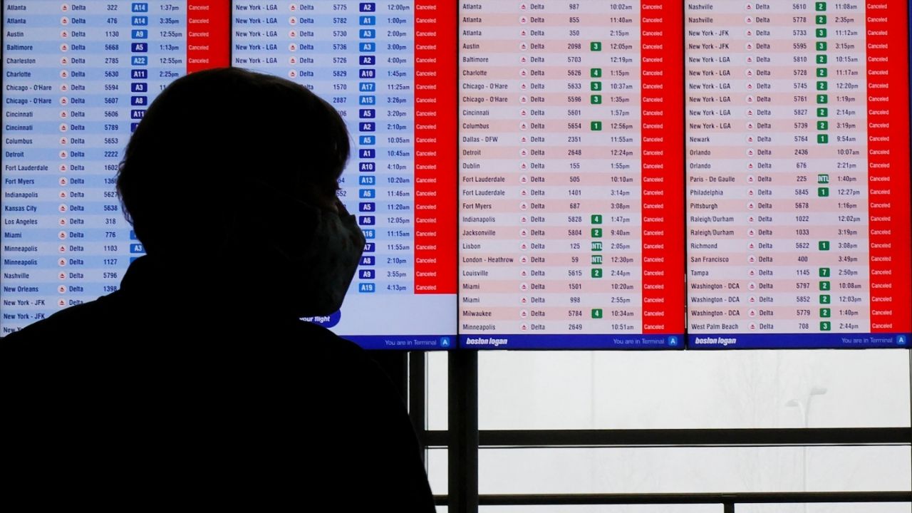 Cancelled flights are displayed on a board at Logan International Airport during a winter blizzard snow storm in Boston, Massachusetts, U.S., February 23, 2026. (Reuters/Brian Snyder)
