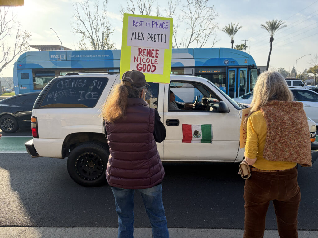 Protestor in SUV drives up and down Herndon and Blackstone blasting Spanish music in solidarity with Anti-ICE demonstration on Feb.7. (Maryanne Casas-Perez/ GV Wire)