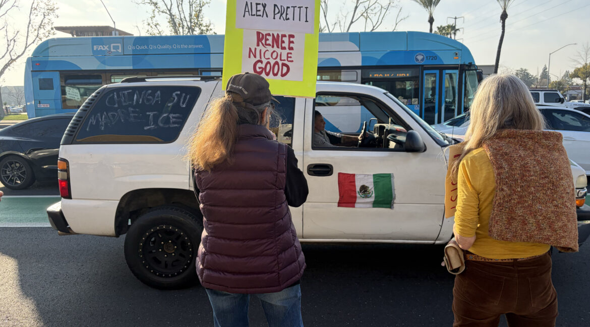 Protestor in SUV drives up and down Herndon and Blackstone blasting Spanish music in solidarity with Anti-ICE demonstration on Feb.7. (Maryanne Casas-Perez/ GV Wire)