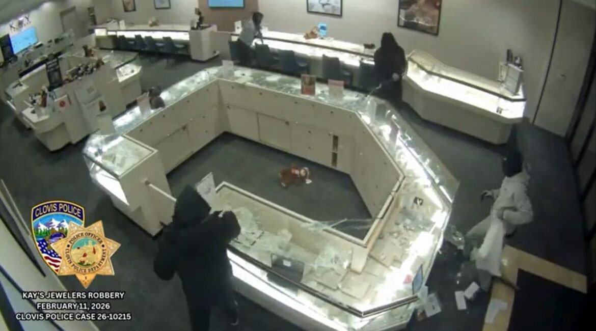 Clovis police are searching for four masked suspects who used sledgehammers in a smash-and-grab robbery at a Kay Jewelers near Herndon and Sunnyside, fled in a silver sedan, and left no injuries reported. (Clovis PD)